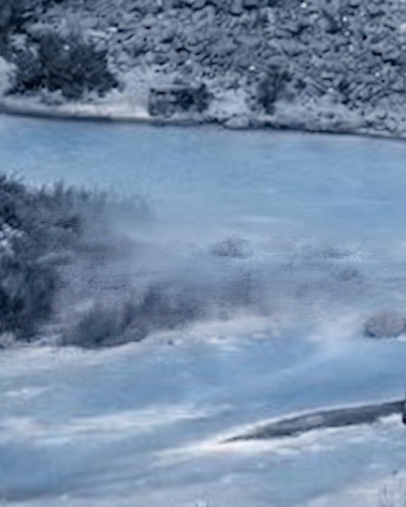 Misty river running through a rocky canyon